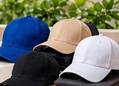 Blank baseball caps in blue, beige, black and white