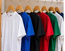 Plain promotional T-shirts in assorted colours on hangers